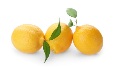 Whole ripe lemons on white background
