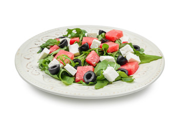 Plate with delicious watermelon salad on white background