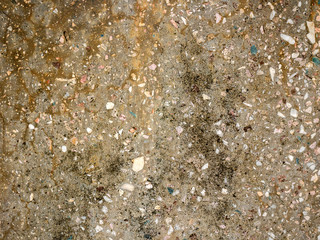 The texture of a stone fence made of granite. Background