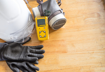 Standard personal protective equipment on wooden table. top view, concept safety 