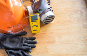 Standard personal protective equipment on wooden table. top view, concept safety 