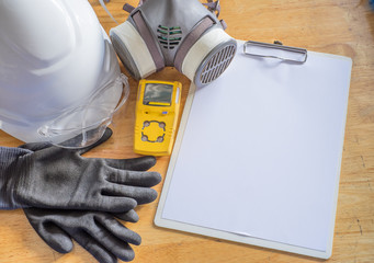 Standard personal protective equipment on wooden table. top view, concept safety 