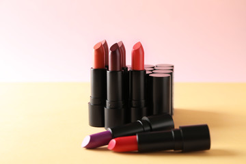 Lipsticks of different shades on color table