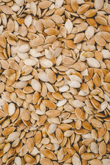 Raw pumpkin seeds background for design