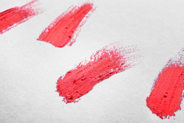 Bright lipstick strokes on white background
