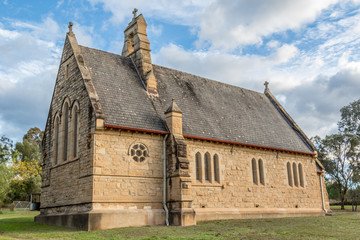 Fototapeta na wymiar Close up of sandstone church in rural setting