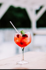Close up of a red cocktail in a glass