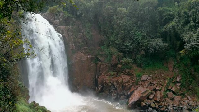 close up of a small waterfall in a deep forest