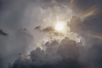Selbstklebende Fototapete Himmel dramatic grey sky with sun