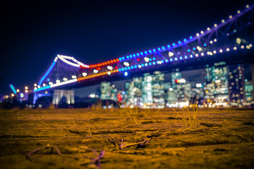 Fototapeta na wymiar Ground of seafront against lights of city