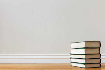 a stack of books on the floor