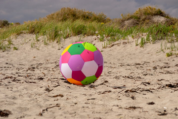 Colorfull ball rolling in the beach