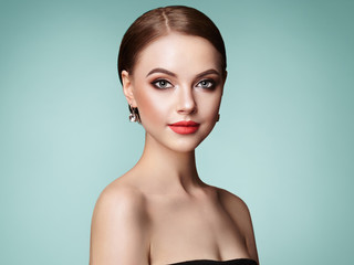 Beautiful Young Woman with Clean Fresh Skin. Perfect Makeup. Beauty Fashion. Eyelashes. Cosmetic Eyeshadow. Highlighting. Cosmetology, Beauty and Spa