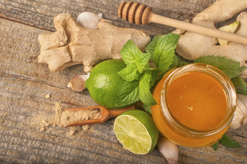 Ginger, honey and lime, mint and garlic. The concept of natural nutrition and medicine.