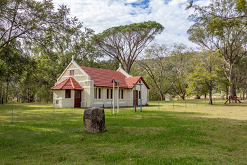 Country stone church in rural landscape setting