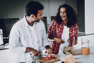 Afro American Couple Cooking At Kitchen Concept.