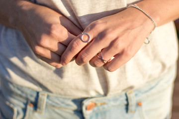 Female hand with silver jewelery, rings and bracelets minimalistic style