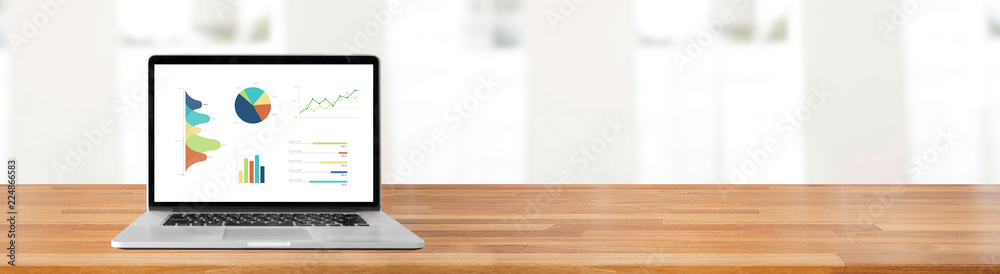 Aufkleber modern computer with keyboard and mouse on table showing charts and graph against office with white 