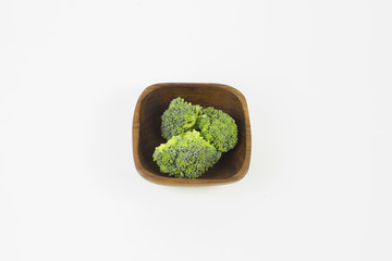 Green vegetables, put in a dish with white background