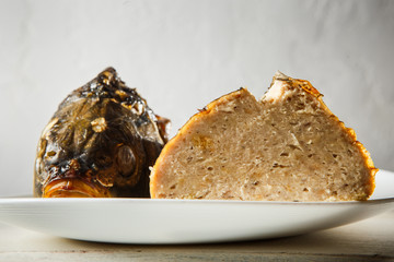 macro plate served with head and tail of stuffed fish