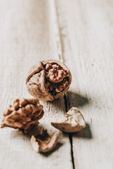 close-up view of organic cracked walnut on wooden table