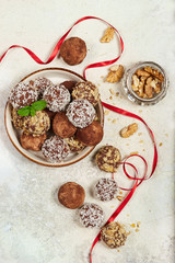 Delicious chocolate truffles. Biscuit cakes in a shape of balls. Traditional Russian cakes Kartoshka.