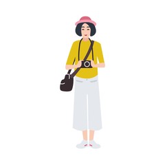 Woman photographer holding photo camera and photographing. Creative profession or occupation. Cute female cartoon character isolated on white background. Colored vector illustration in flat style.