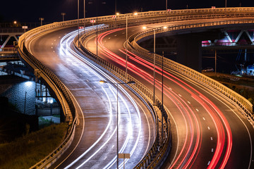 Road car light streaks. Night light painting stripes. Long exposure photography.