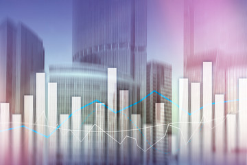 Financial graphs and charts on blurred business center background. Invesment and trading concept.