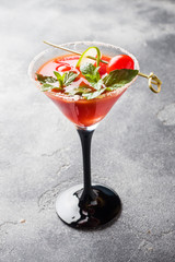 Bloody Mary Alcoholic cocktail with ripe tomatoes and mint. Selective focus