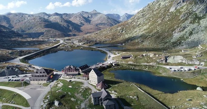 Aerial view of the Gotthard pass with hotel hospiz and mountain lake. The Gotthard Pass is the most important north-south link in the Alps