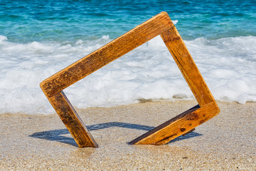 Fototapeta premium wooden picture frame at sea