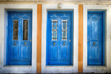 Three old blue doors, Simi Greece