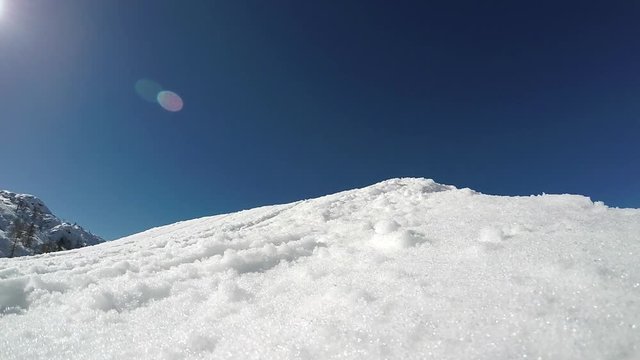 GoPro slow motion - Low angle view of snowboarder jumping over the kicker