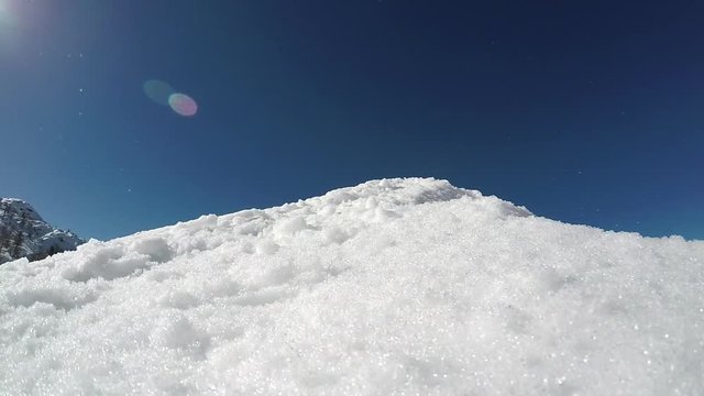 GoPro slow motion - Low angle view of skier jumping over the kicker