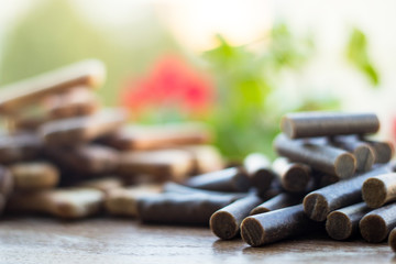 Dog tasty colored biscuits on wooden background, snacks for dogs