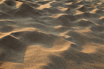 closeup of sand pattern of a beach in the summer
