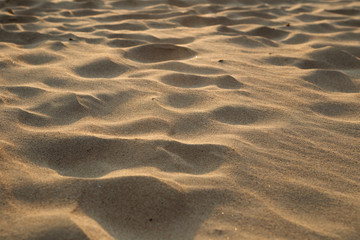 closeup of sand pattern of a beach in the summer