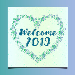 Obraz premium A floral frame in the shape of a heart close-up inside with an inscription - welcome 2019. The idea of ​​a New Year's greeting card 