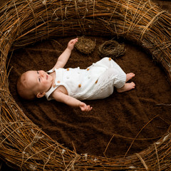 Newborn baby girl. Newborn baby in crib. Child care and protection. A place for childrens dreams. Maternal and child health care. International childrens day