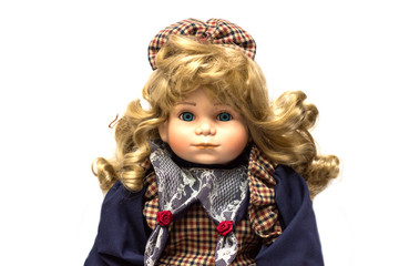 Old porcelain doll on White Background. Concept of time.