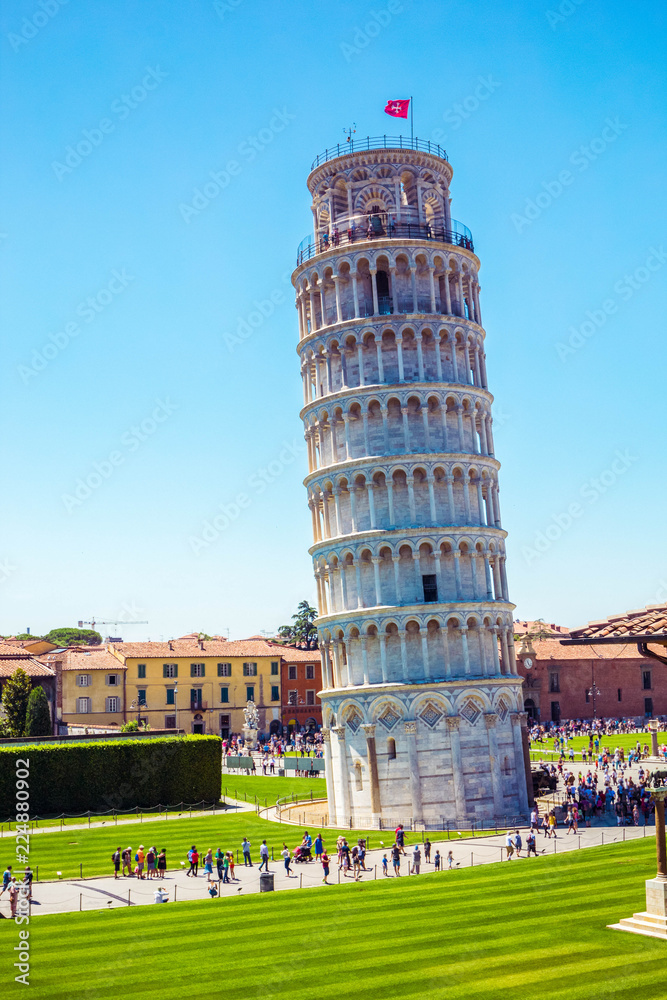 Wall mural leaning tower, famous inclined tower of pisa with green lawn in pisa, tuscany, italy