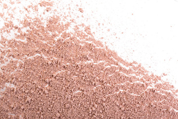 Cosmetic background, minerl clay texture. Pink ask dry clay for facecare and bodycare. Isolated on a white background
