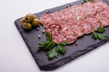 Saucisson sec delicious french salami on a white background