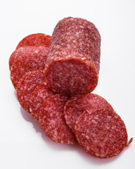 delicious sliced salami on a white background