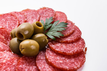 delicious sliced salami on a white background