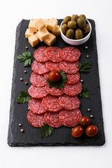 delicious sliced salami on a stone plate white background