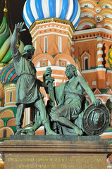 Fototapeta na wymiar Statue of Kuzma Minin and Dmitry Pozharsky in front of St. Basil Cathedral on Red Square in Moscow.