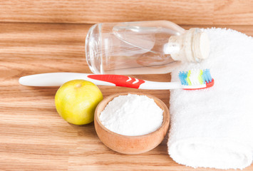 baking soda and lemon on wooden table