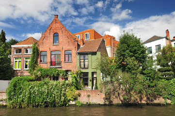 Canal and old houses in Bruges (Brugge) Belgium.